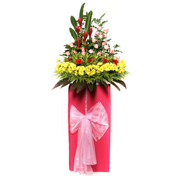 Gerbera daisies, Roses and ginger flowers arranged on a box stand for grand opening and congratulatory occasions by Katong Flower Shop for Singapore Delivery.