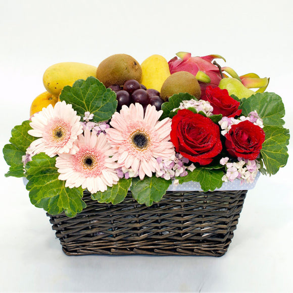 Get Well basket with tropical fruits and gerbera daisies, roses and green foliage by Katong Flower Shop for Singapore Delivery 