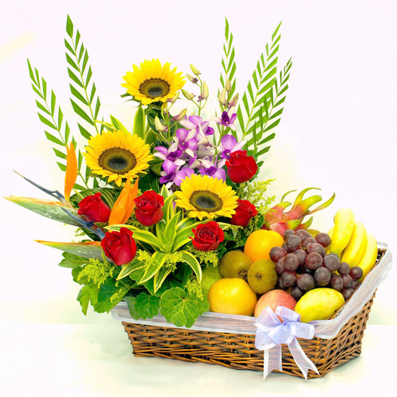 A luxurious basket of beautiful sunflower, roses and orchids as well as tropical fruits by Katong Flower Shop for Singapore Delivery