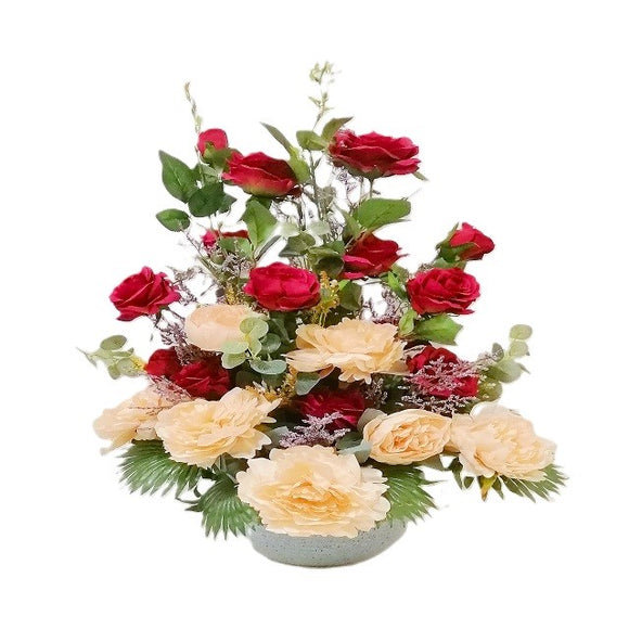 Artificial red and peach roses in a pot table flower