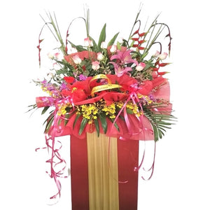 Pink lilies, pink roses, orchids and heliconia grand opening congratulatory flowers