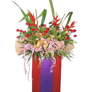 Pink gerbera, purple orchids, purple chrysanthemum, red roses and heliconia grand opening congratulatory flowers