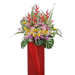 Pink lilies, yellow gerbera, ginger flower and heliconia grand opening congratulatory flowers