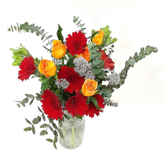Orange roses and red gerberas table flower arrangement