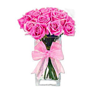12 pink roses in a glass vase table flower arrangement