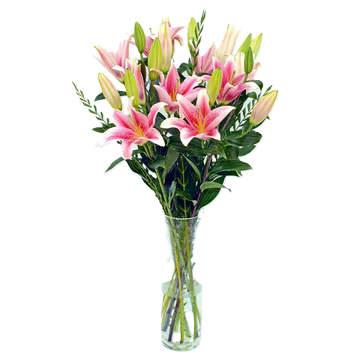 Pink lilies in a vase table flower arrangement