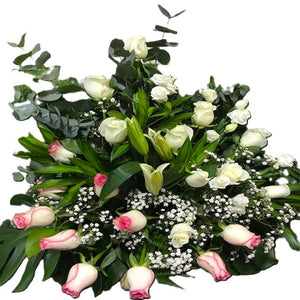 White roses, centre pink roses and white lilies table flower arrangement