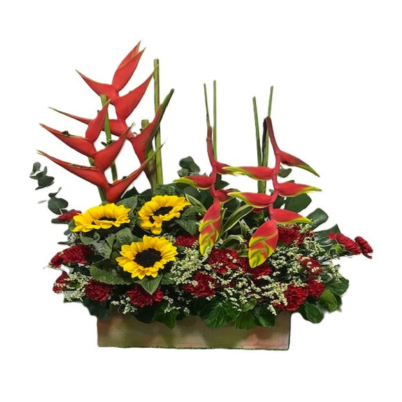 Sunflowers, red carnations and heliconia table flower arrangement