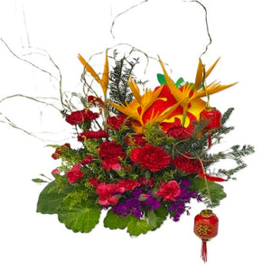 Red carnations and heliconia CNY table flower arrangement