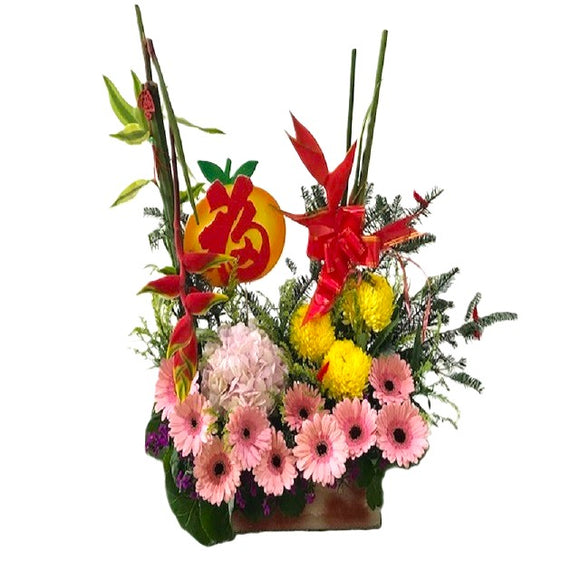 Pink gerberas, pink hydrangea, chrysanthemum and heliconia CNY table flower arrangement