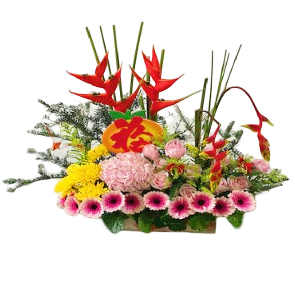 Pink roses, pink gerberas, pink hydrangea, chrysanthemum and heliconia CNY table flower arrangement
