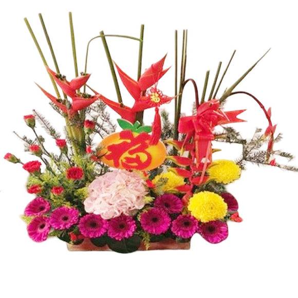 Red carnations, pink gerberas, pink hydrangea, chrysanthemum and heliconia CNY table flower arrangement