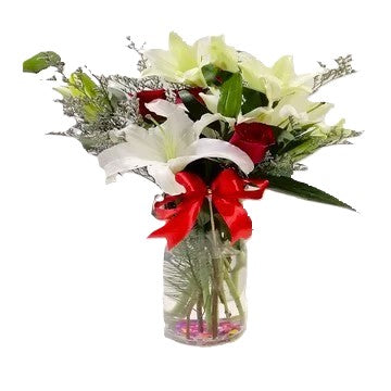 White lilies and red roses table flower arrangement