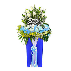 White lilies and blue chrysanthemum wreath