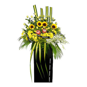 Sunflowers, yellow roses and yellow chrysanthemum wreath