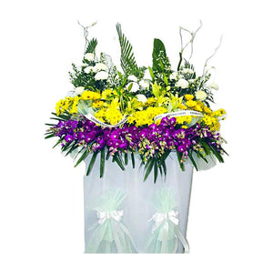 Yellow gerbera, purple orchids, yellow and white chrysanthemum wreath