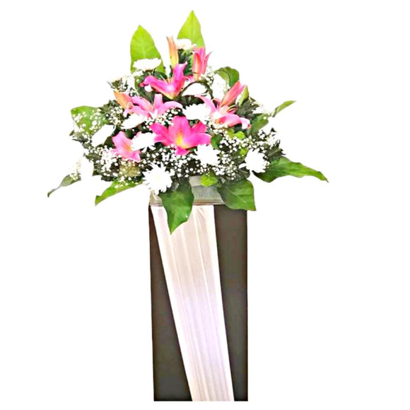 Pink lilies and white chrysanthemum wreath