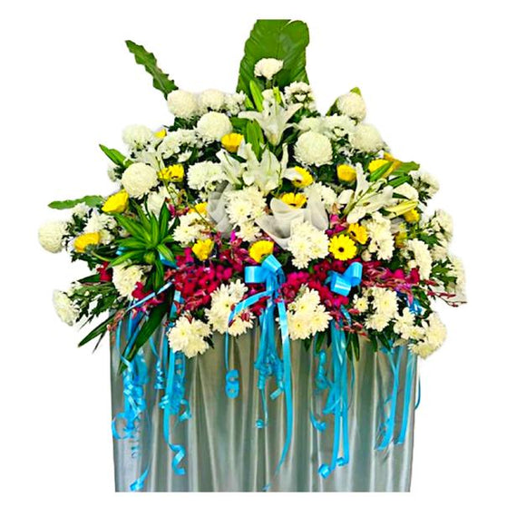 White lilies, yellow gerbera and white chrysanthemum wreath