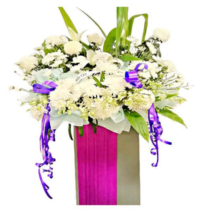 White lilies, white orchids and white chrysanthemum wreath