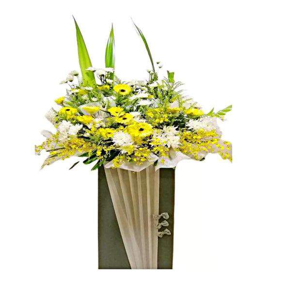 Yellow gerbera, white chrysanthemum and yellow orchids wreath