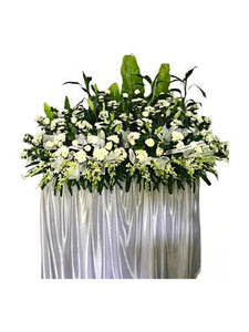 White lilies, white orchids and white chrysanthemum wreath