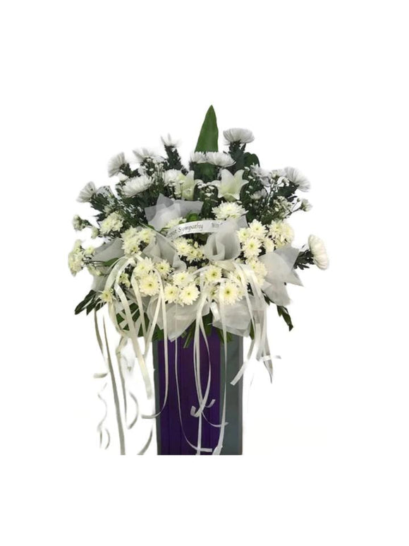 White lilies and white chrysanthemum flowers wreath