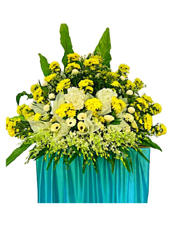 Yellow gerbera, white brassica and yellow chrysanthemum wreath