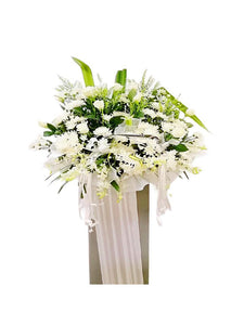 White orchids, white roses and white chrysanthemum wreath