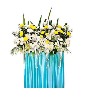 White lilies, yellow and white chrysanthemum flowers wreath