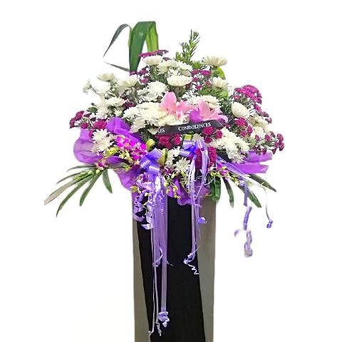 Pink lilies, purple and white chrysanthemum flowers wreath