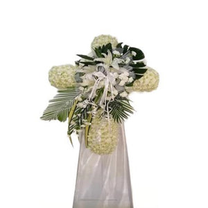 White lilies, white roses and white orchids cross wreath