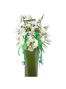 White lilies, white orchids and white chrysanthemum flowers wreath