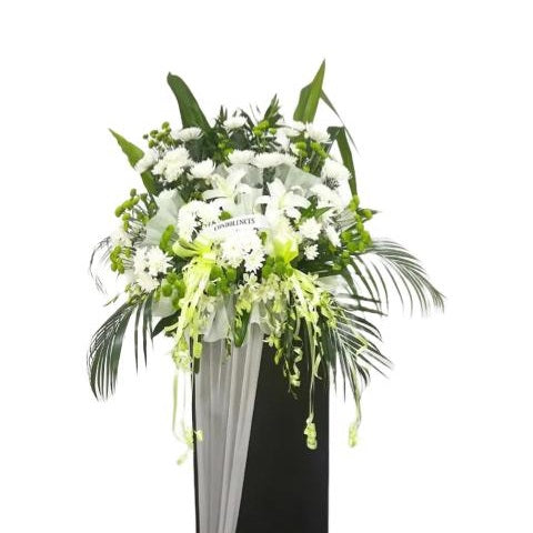 White lilies, white orchids and white chrysanthemum flowers wreath