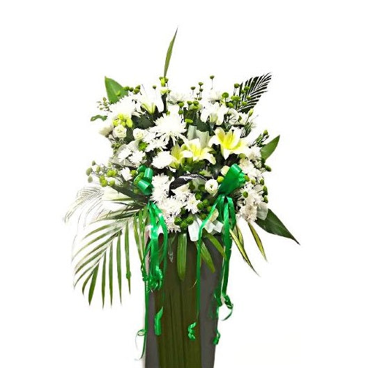 White lilies and white chrysanthemum flowers wreath