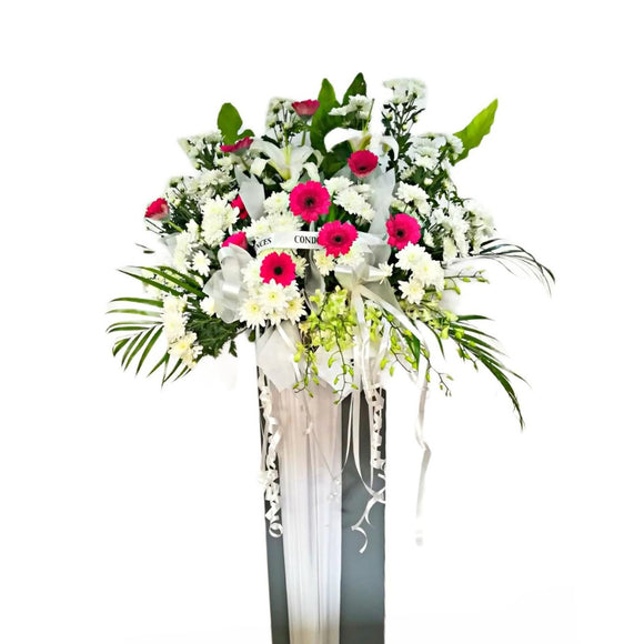 White lilies, pink gerberas and white chrysanthemum flowers wreath