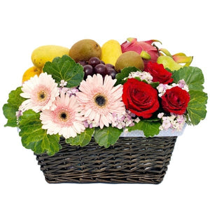 Get well floral fruit gift hamper with gerberas and roses flowers