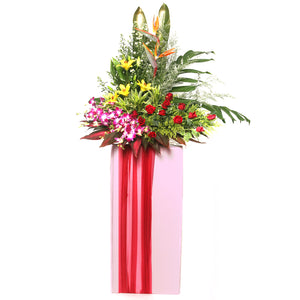 Rose, Orchids, Lilies and Bird of paradise flowers arranged on a box stand for grand opening and congratulatory occasions by Katong Flower Shop for Singapore Delivery.