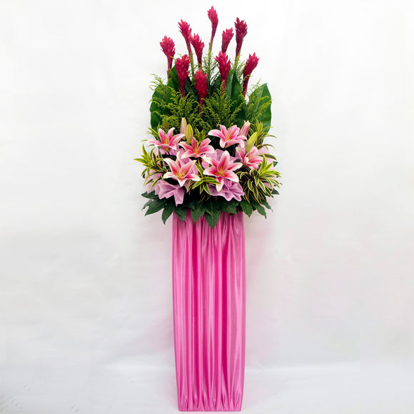 Lilies and ginger flowers arranged on a box stand for grand opening and congratulatory occasions by Katong Flower Shop for Singapore Delivery.
