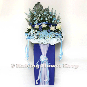 White lilies and blue flowers wreath