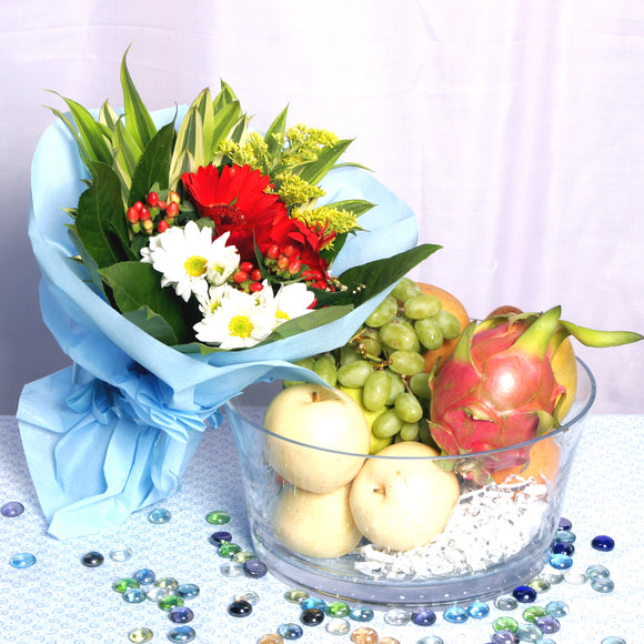 A sweet gift hamper of fruits accompanied with a surprise floral bouquet of designer's choice, by Katong Flower Shop for Singapore Delivery 